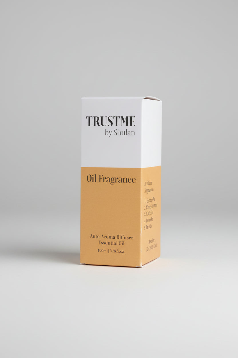 Box of 'Trust Me by Shulan' 100ml oil fragrance on a gray background