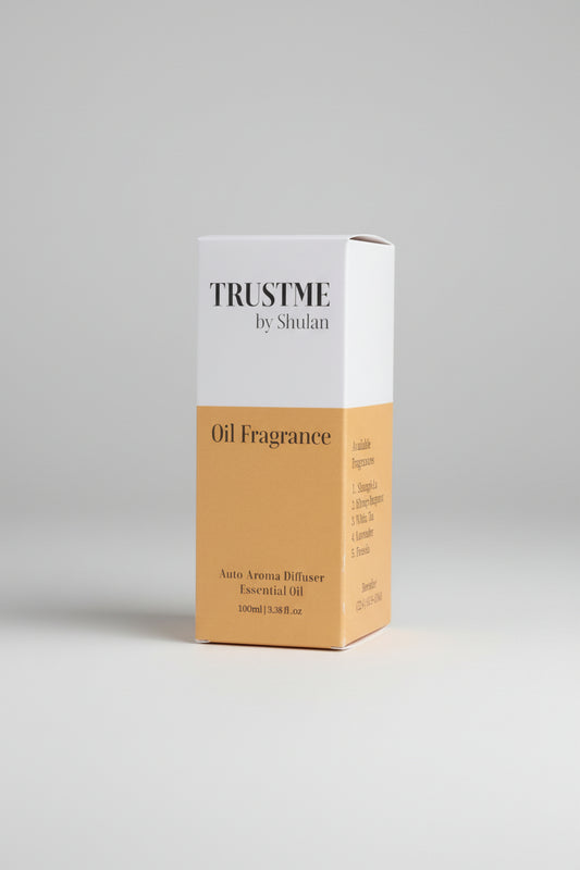 Box of 'Trust Me by Shulan' 100ml oil fragrance on a gray background