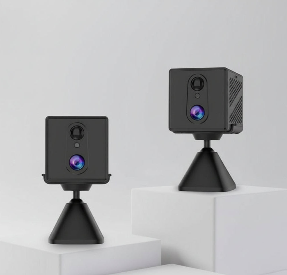 Two black CB70W security cameras on stands against a white background