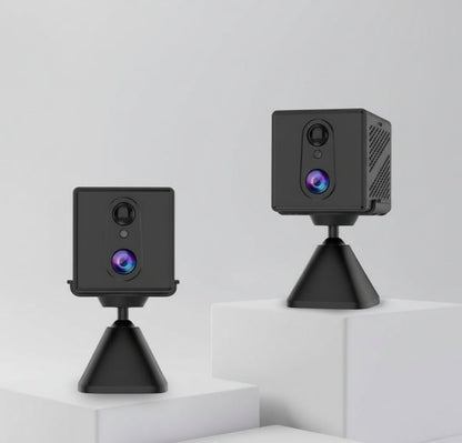 Two black CB70W security cameras on stands against a white background