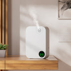 White humidifier diffuser K30 with digital display on a wooden surface, emitting steam.