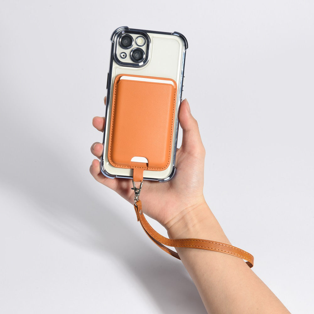 Hand holding a phone case with a Small Qin feng Wallet and strap on a light gray background