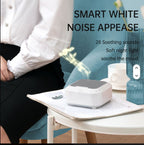 Smart white Noise Sound Machine on a table with a person sitting in the background