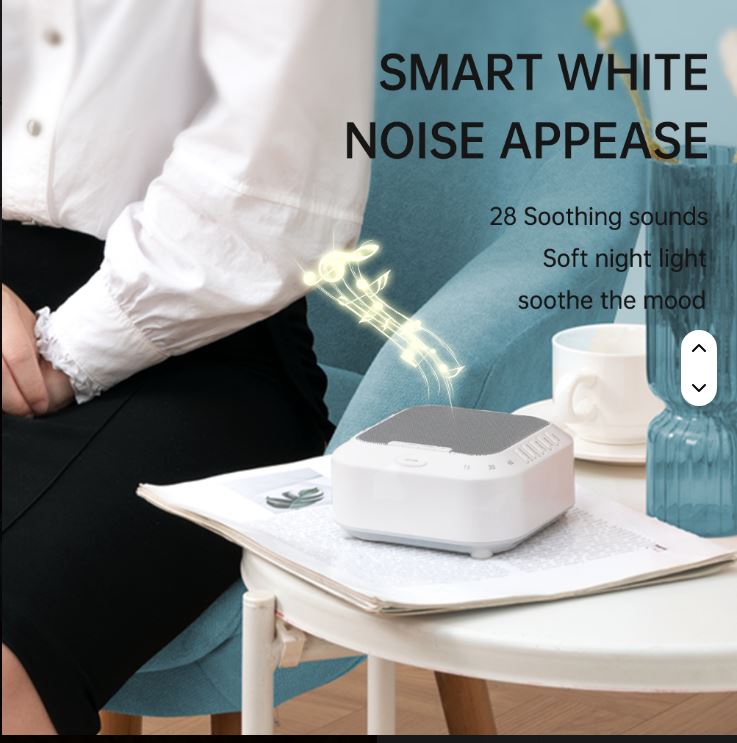 Smart white Noise Sound Machine on a table with a person sitting in the background