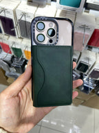 GreenHand Leather Magnetic iPhone Wallet  held in a hand with a blurred store background