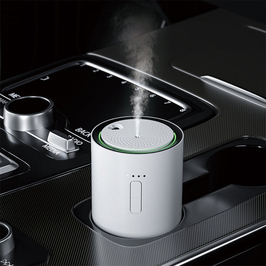 white j03 Car air freshener with steam emitting from it, placed in a car's cup holder.